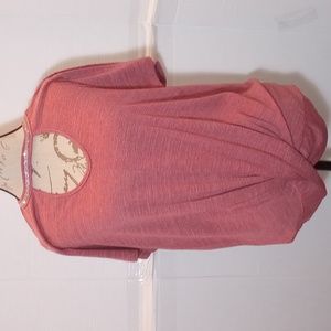 A Mauve colored peekaboo breast, rhinestone neckline, crossbottom blouse